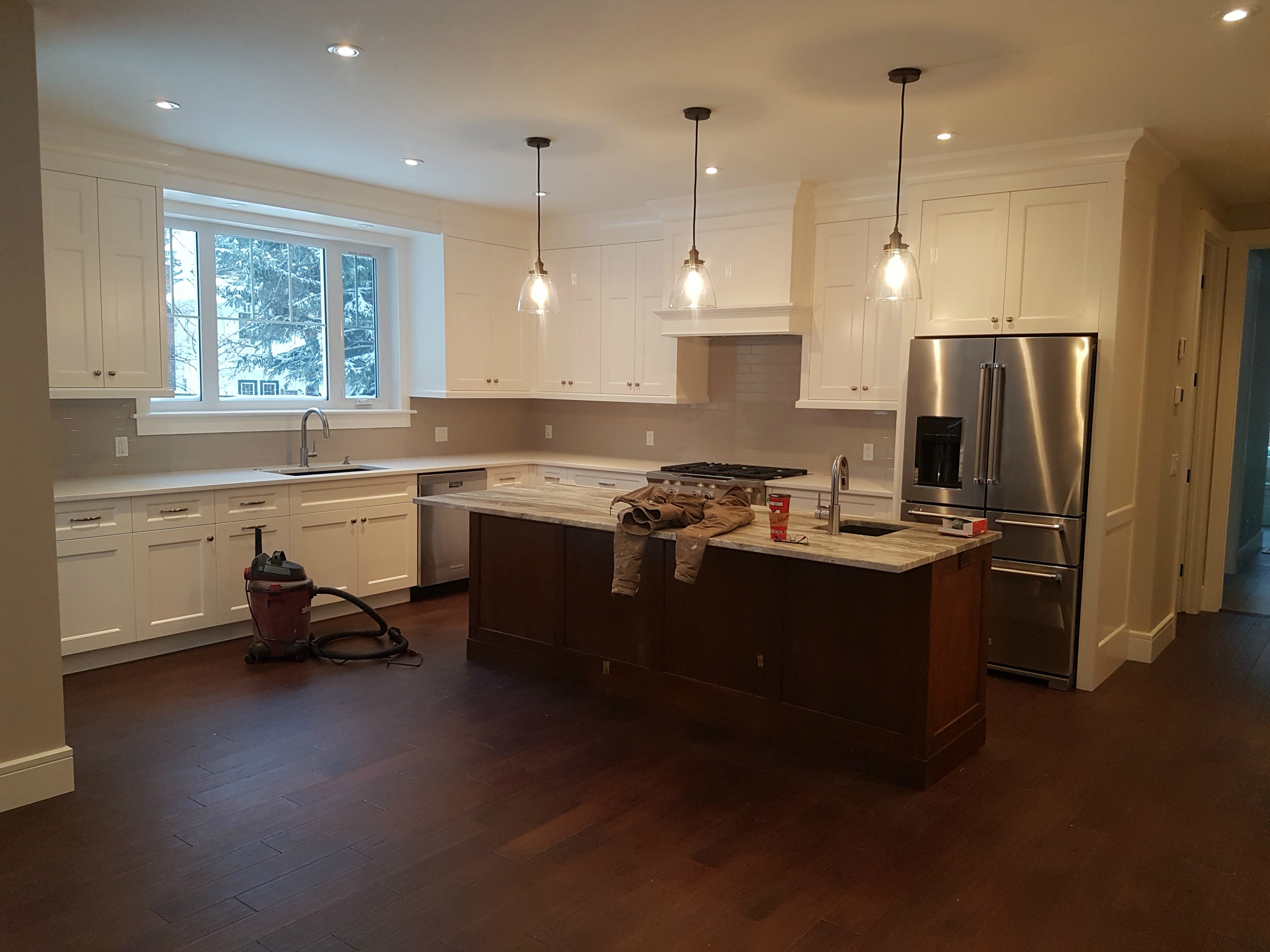 Finished white kitchen cabinet refinishing project