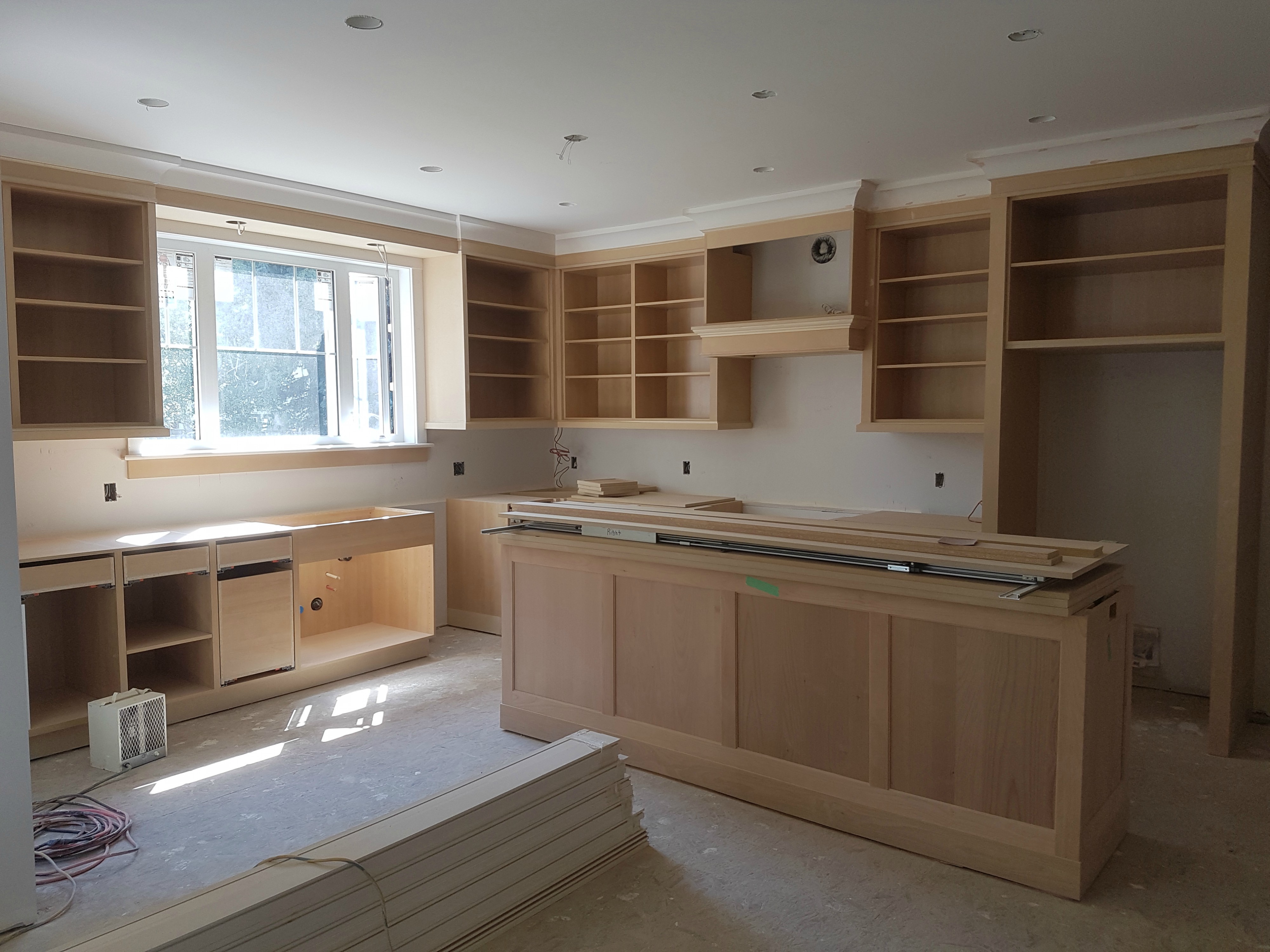 Kitchen cabinet installation before finishing