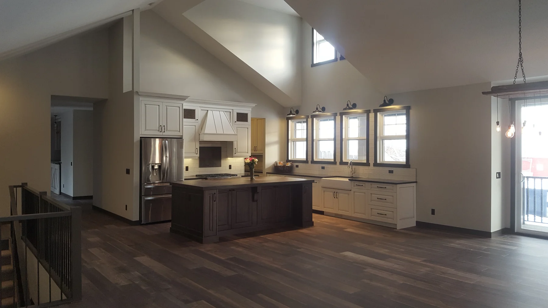 Freshly painted open-concept interior with kitchen and living area