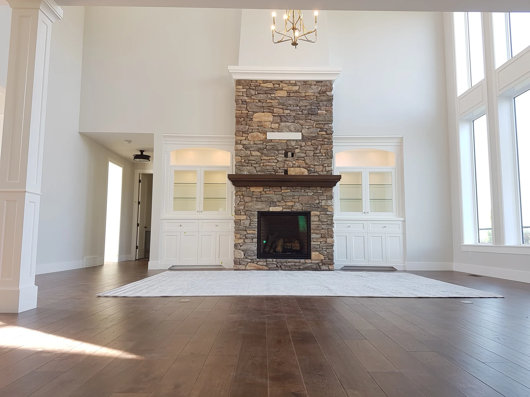 Wide main floor living room with fireplace and fresh interior paint
