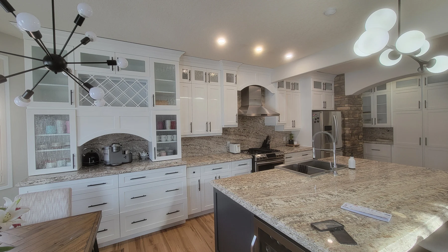 Bright custom kitchen with painted cabinetry and island